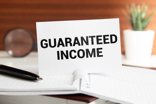 guaranteed income text on paper