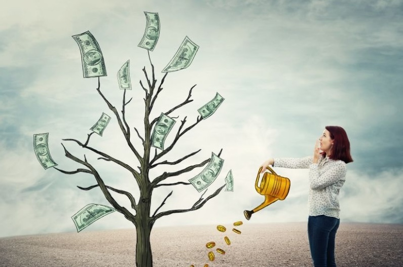 Woman watering a tree that grows money, symbolizing growing retirement savings and strategic RMD planning to maximize tax efficiency.